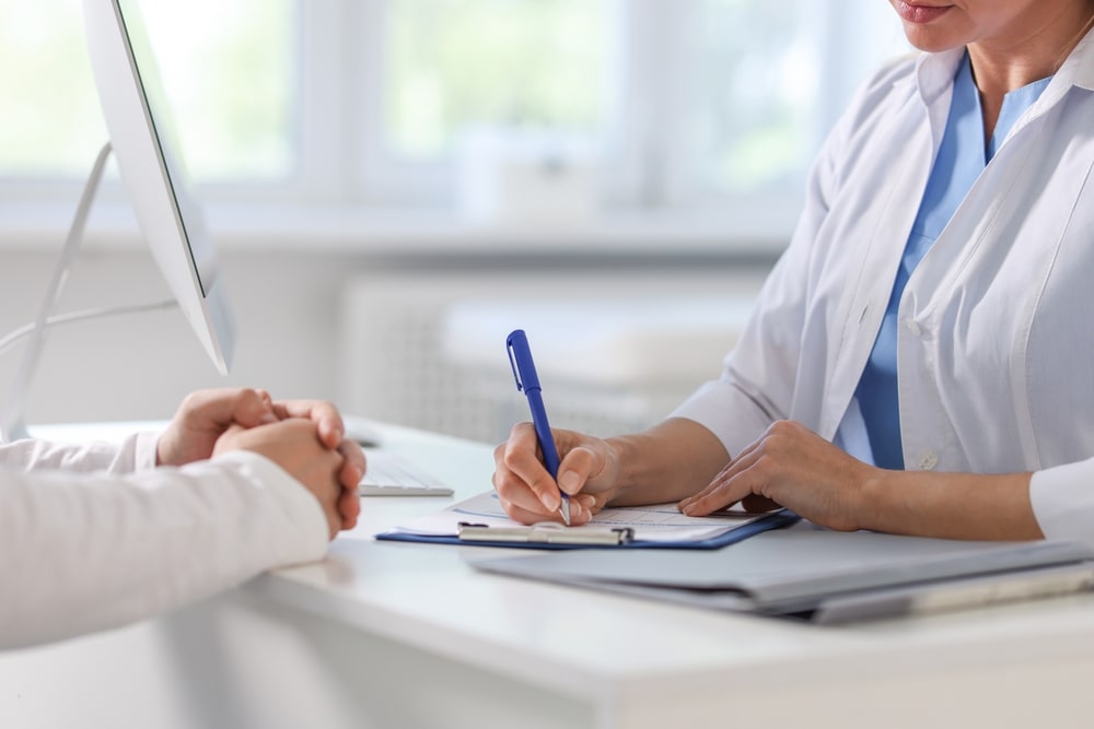 female-patient-doctor-visit-min
